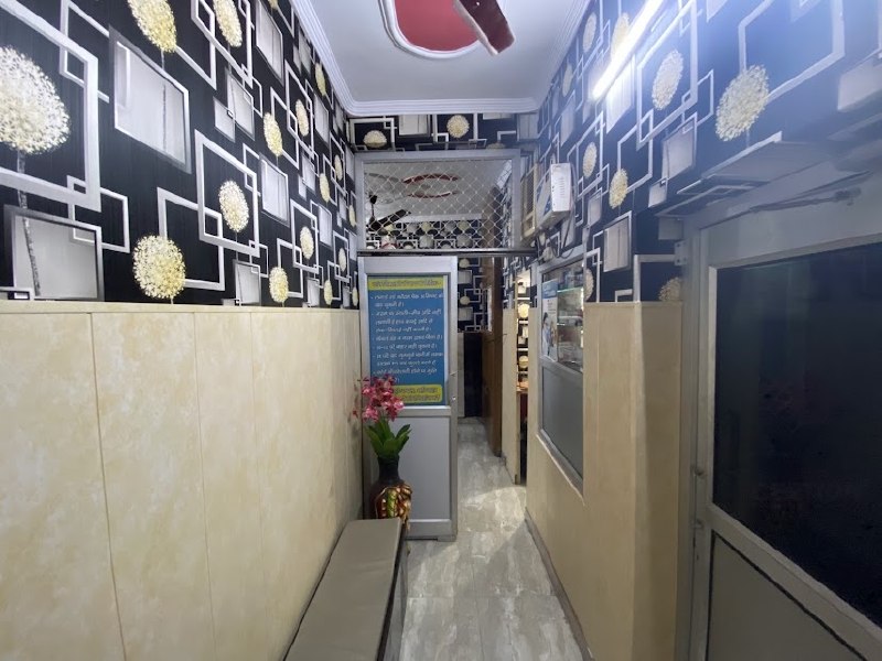 Clean clinic corridor with waiting bench at Panwar Dental Clinic