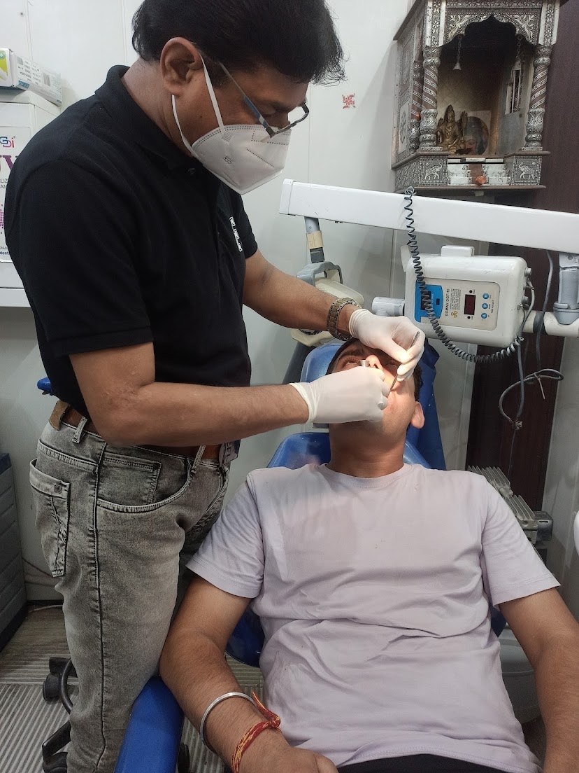 Dentist performing a close dental examination at Panwar Dental Clinic