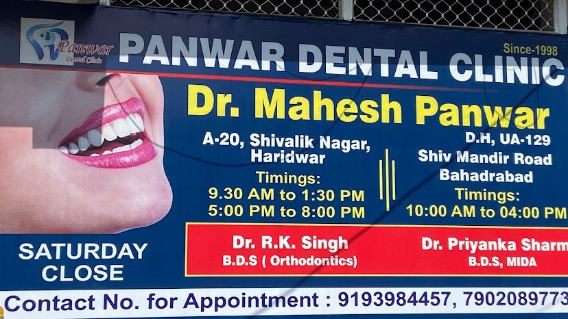 Panwar Dental Clinic signboard showing Dr Mahesh Panwar and branch information