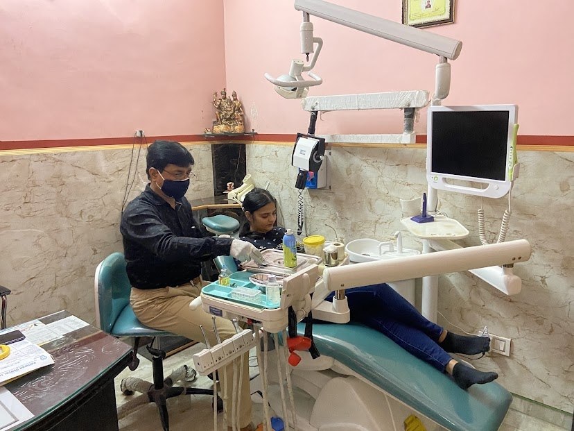 Dentist providing treatment to a patient at Panwar Dental Clinic